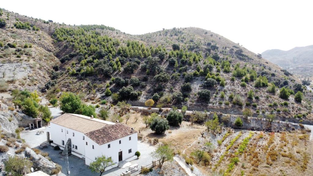 an aerial view of a house on a mountain at Casas Rurales Cortijo Leontino in Taberno