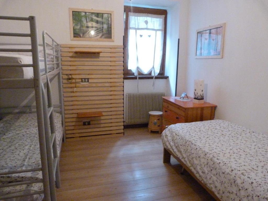 Postel nebo postele na pokoji v ubytování Apartments Carisolo - Val Rendena