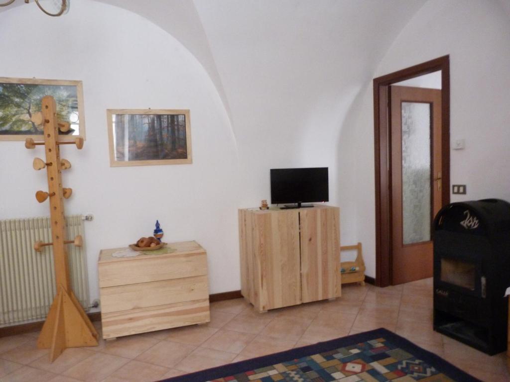 TV a/nebo společenská místnost v ubytování Apartments Carisolo - Val Rendena