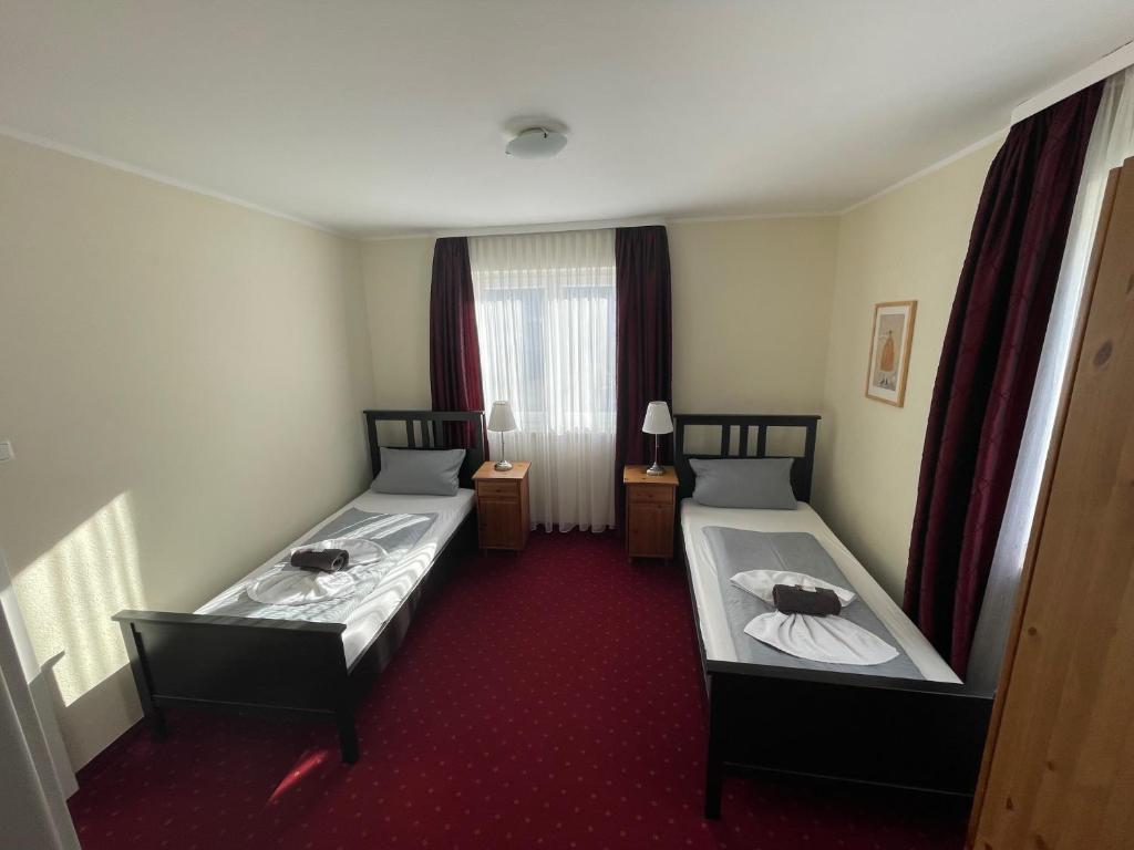 Postel nebo postele na pokoji v ubytování Hotel Leitner