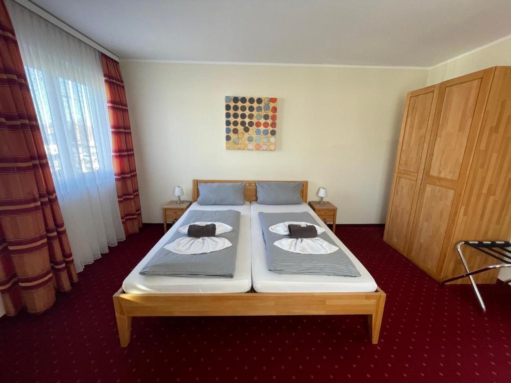 Postel nebo postele na pokoji v ubytování Hotel Leitner