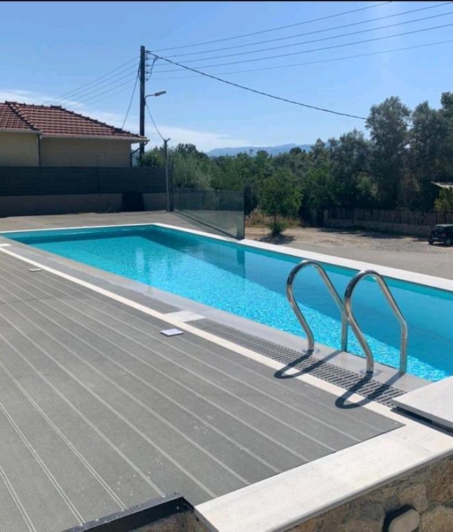 a swimming pool on top of a house at Melivia Luxury Suite in Nikiana