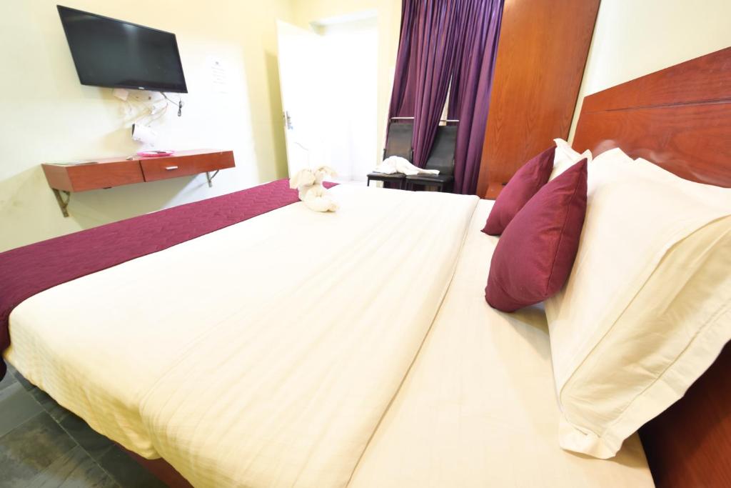 Postel nebo postele na pokoji v ubytování HOTEL KING PARK