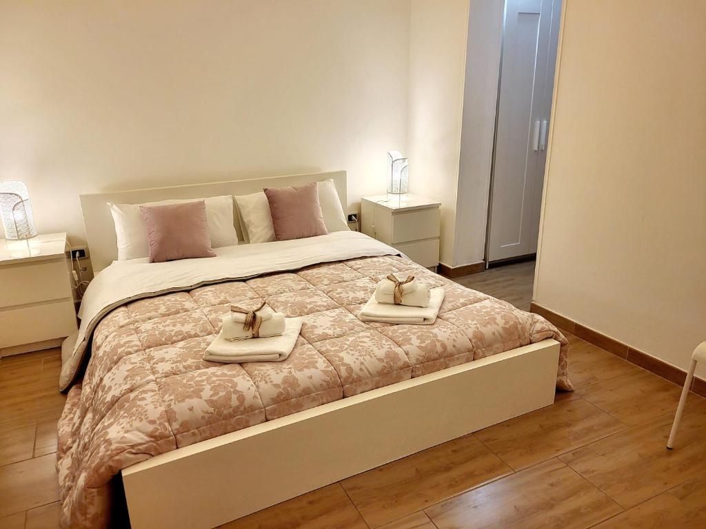 Postel nebo postele na pokoji v ubytování La Perla Di Noto