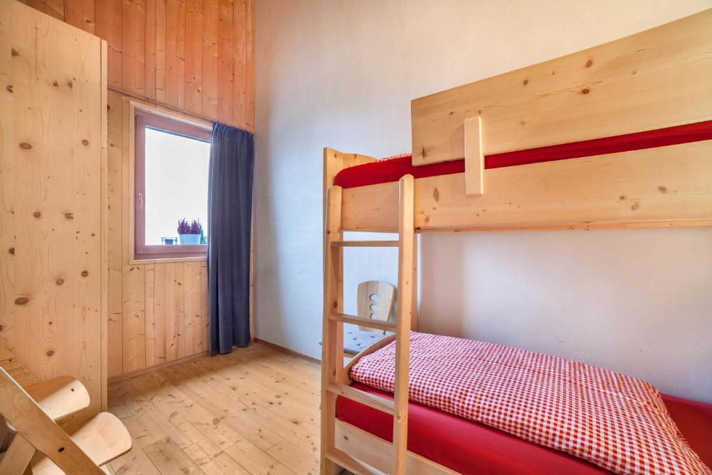 A bed or beds in a room at Grushof App Köpfl