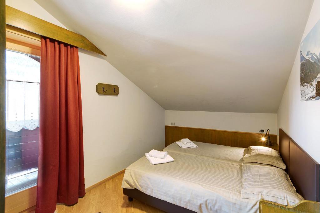 Łóżko lub łóżka w pokoju w obiekcie Casa Marcos n 34