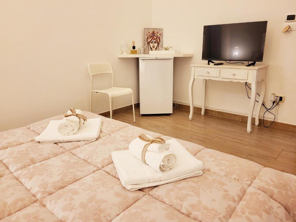 Postel nebo postele na pokoji v ubytování La Perla Di Noto