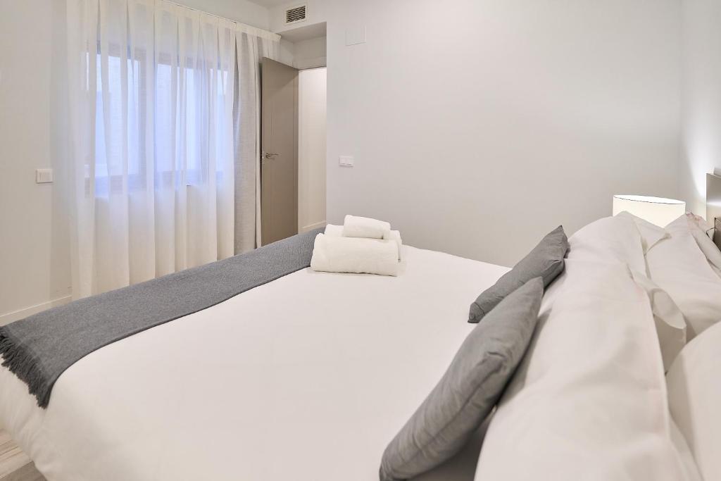 Postel nebo postele na pokoji v ubytování Inés Luna Suites