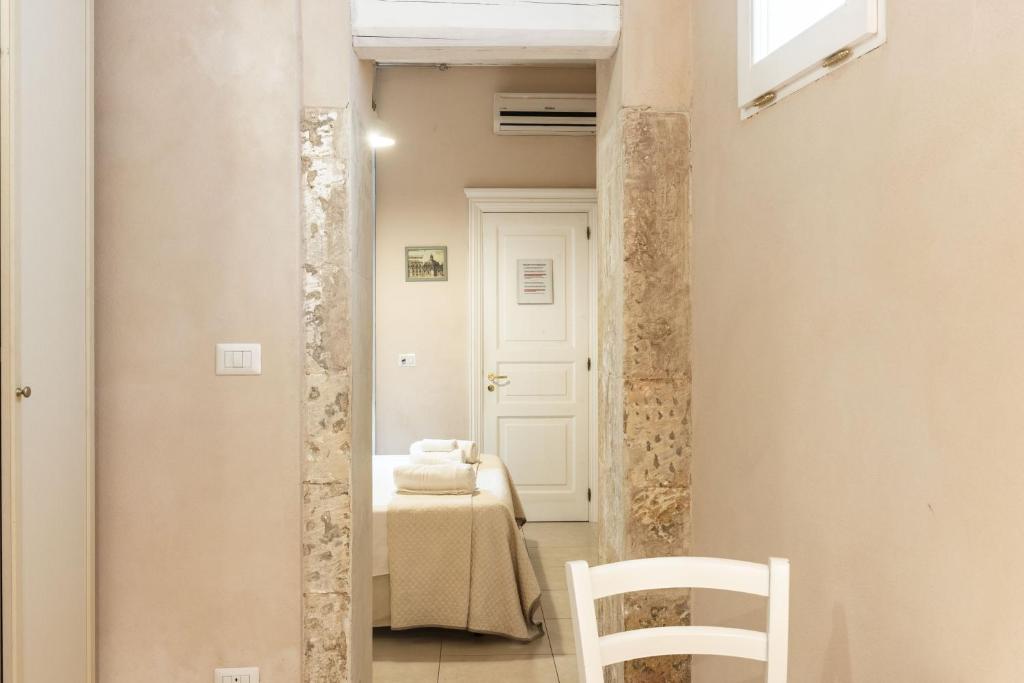 Postel nebo postele na pokoji v ubytování Dedalo Rooms