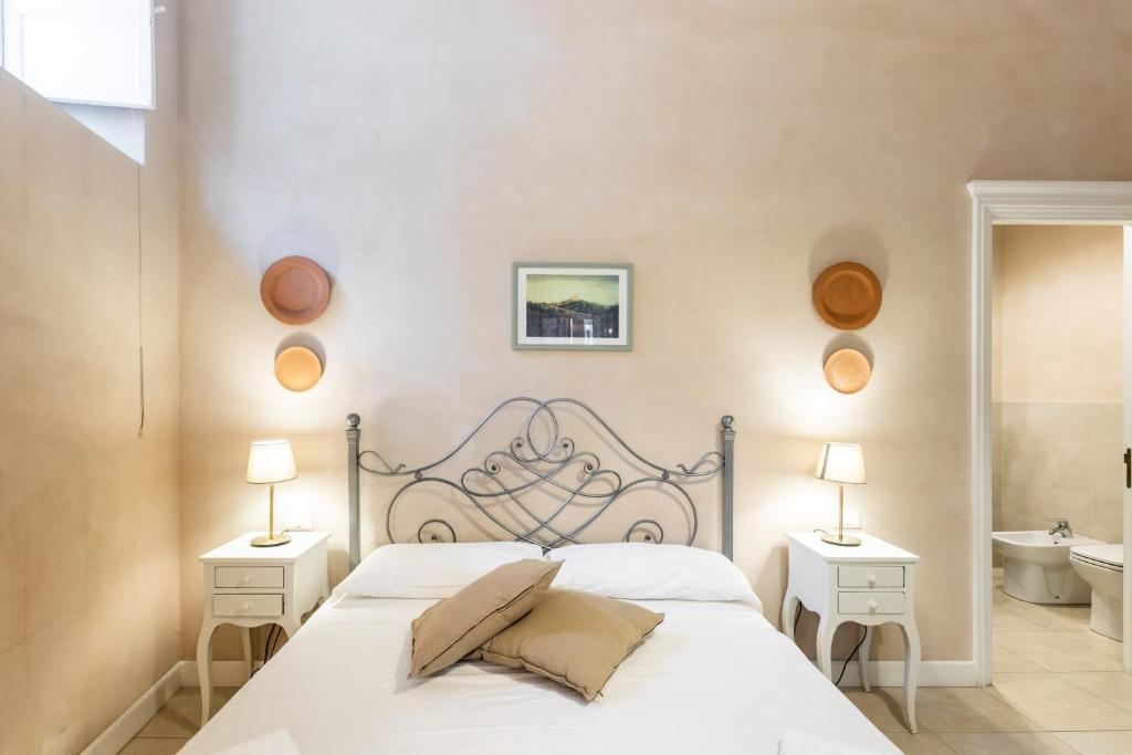 Postel nebo postele na pokoji v ubytování Dedalo Rooms