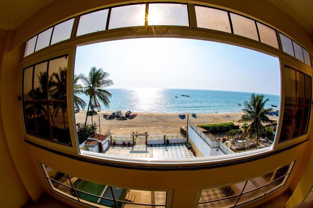 a view of the beach from a window at Brisotel - Beira Mar in Luanda