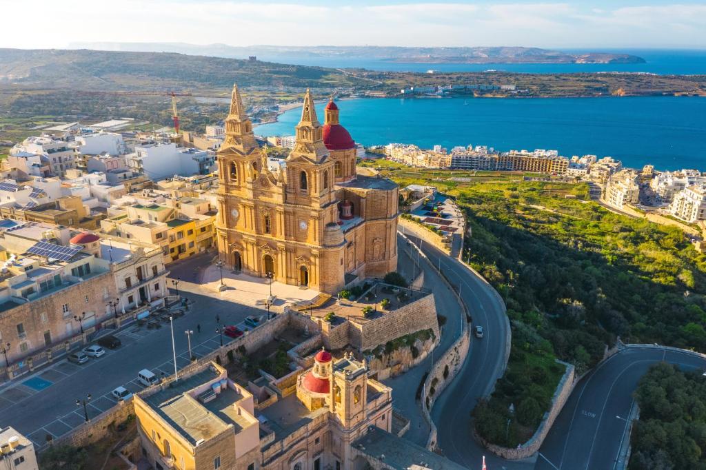 an aerial view of the church of our lady of the assumption in dubrovnik at Mellieha Bay 3 Bedroom Apartment " Bliss on the bay " in Mellieħa