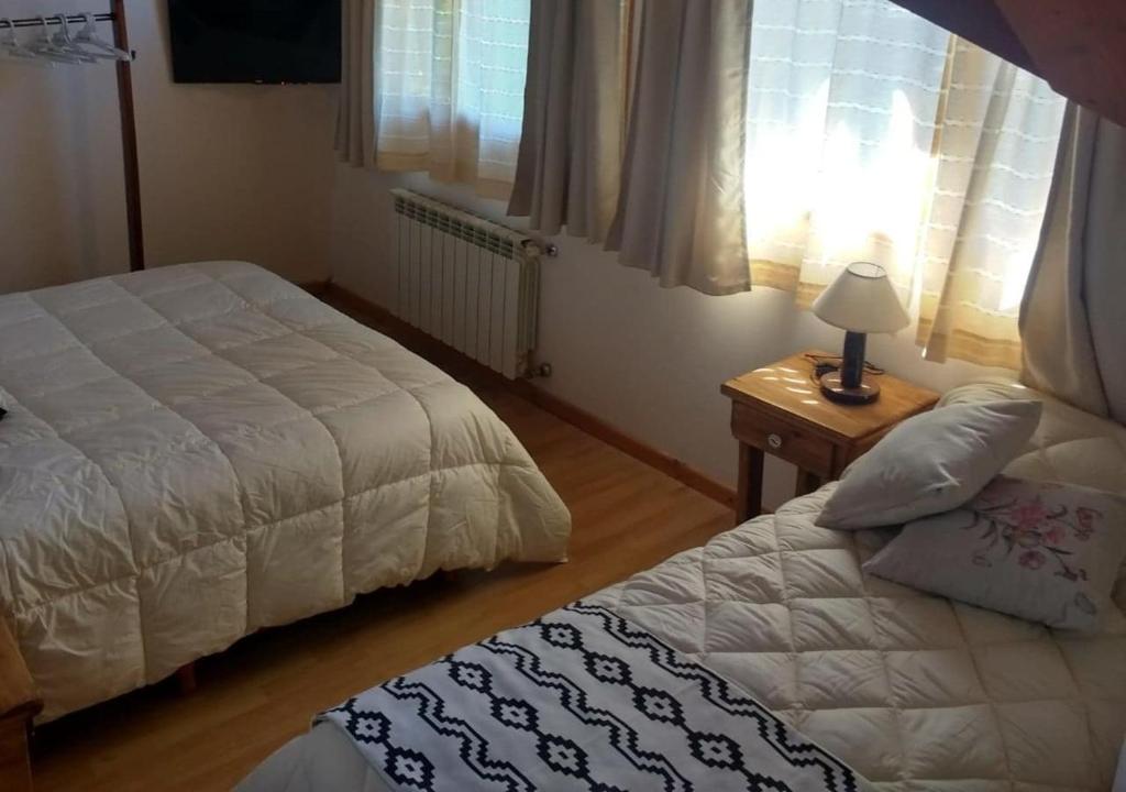 Postel nebo postele na pokoji v ubytování Paso Puyehue