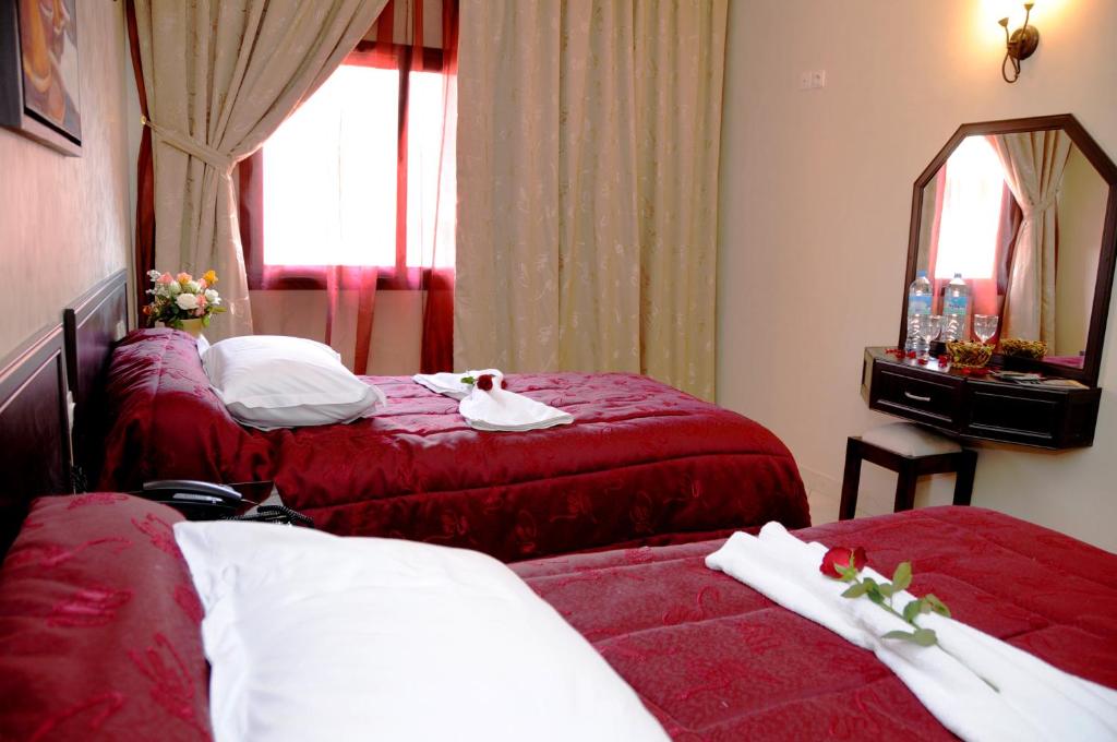 Postel nebo postele na pokoji v ubytování Residence Hotel Assounfou