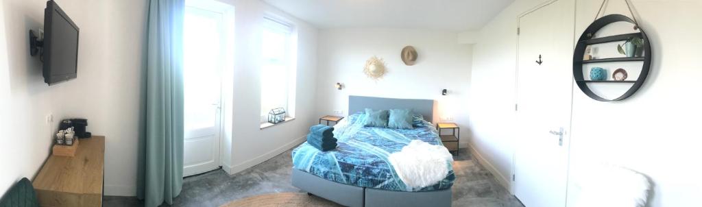 Postel nebo postele na pokoji v ubytování Bed no breakfast de Kapitein