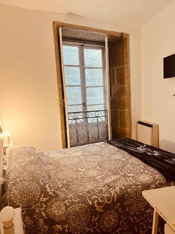 Posteľ alebo postele v izbe v ubytovaní Hostal San Pelayo