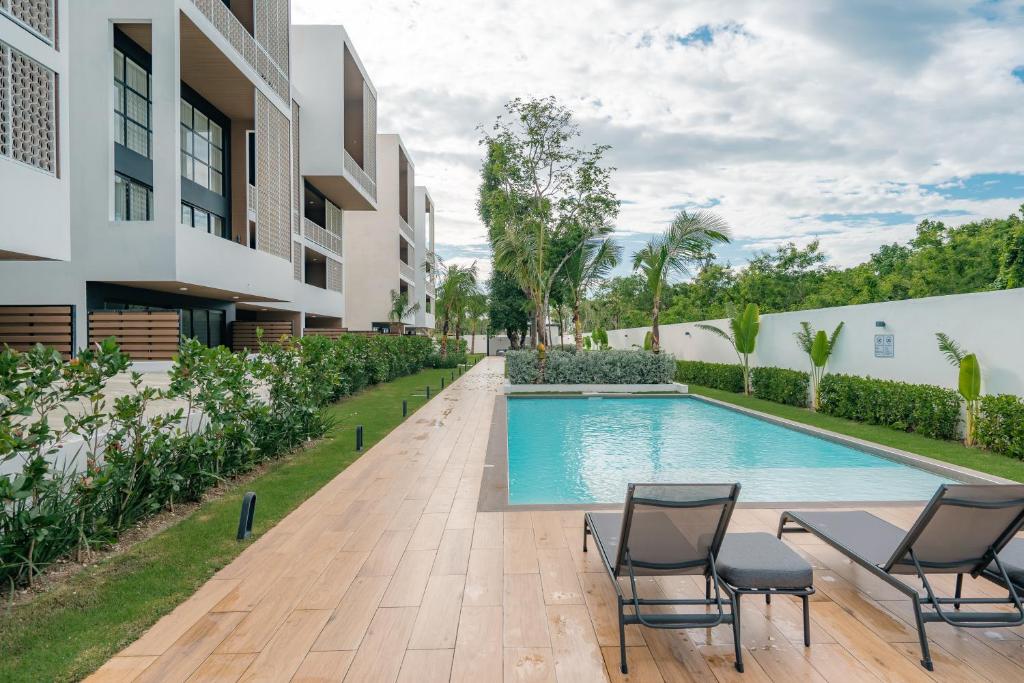 an image of a swimming pool at a house at Lumina at Flats Punta Cana Village in Punta Cana