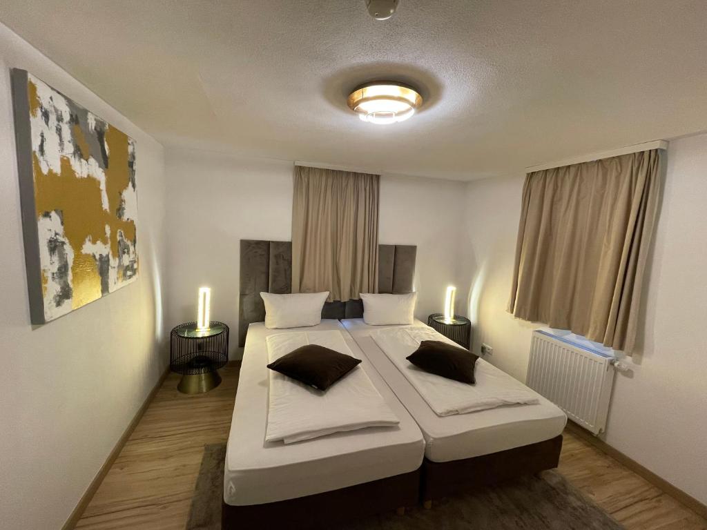 Postel nebo postele na pokoji v ubytování A&C Hotel