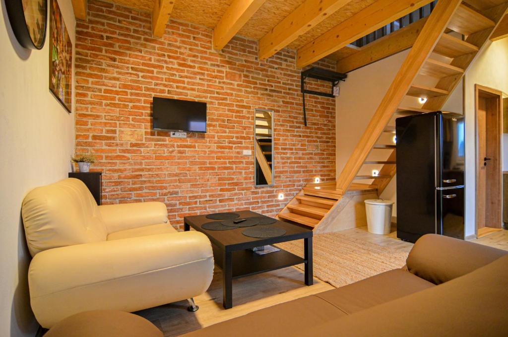 TV a/nebo společenská místnost v ubytování Apartmány Zaječák