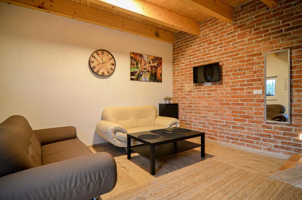 TV a/nebo společenská místnost v ubytování Apartmány Zaječák