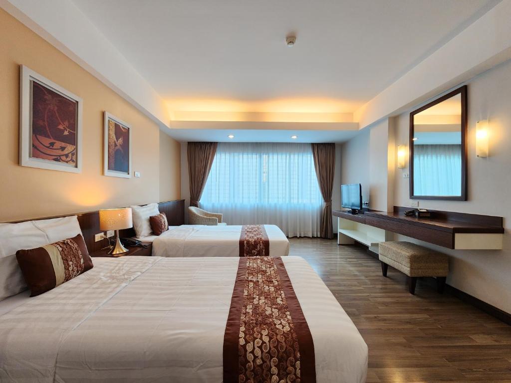 Postel nebo postele na pokoji v ubytování Avion Hotel