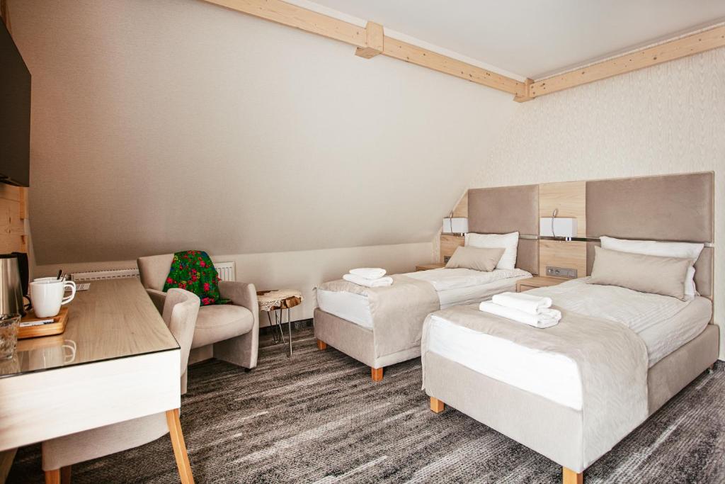 Postel nebo postele na pokoji v ubytování Villa Cannes Resort Zakopane - grota solna, sauna fińska