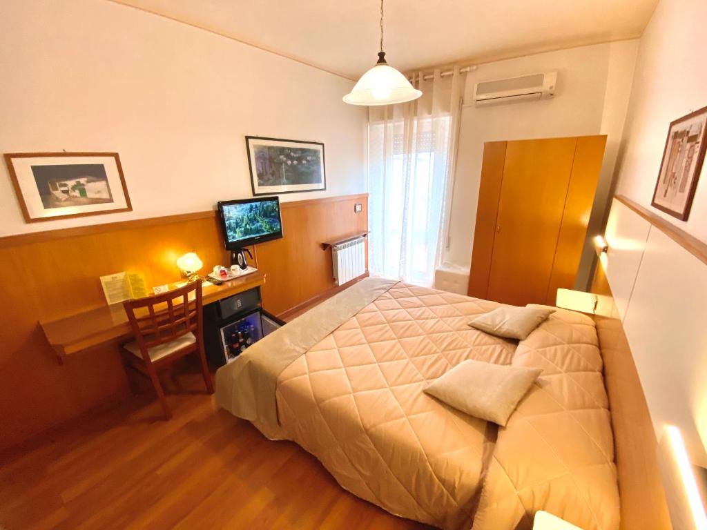Postel nebo postele na pokoji v ubytování Hotel Signa