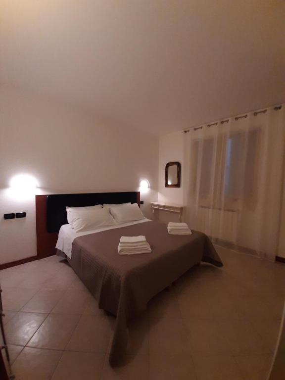 Postel nebo postele na pokoji v ubytování Casa di Clara