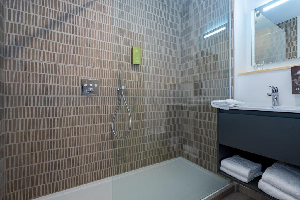 Koupelna v ubytování Appart hôtel En Ville
