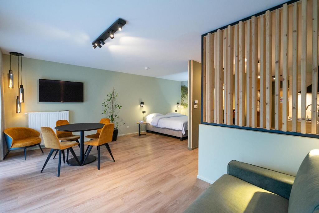Postel nebo postele na pokoji v ubytování Appart hôtel En Ville
