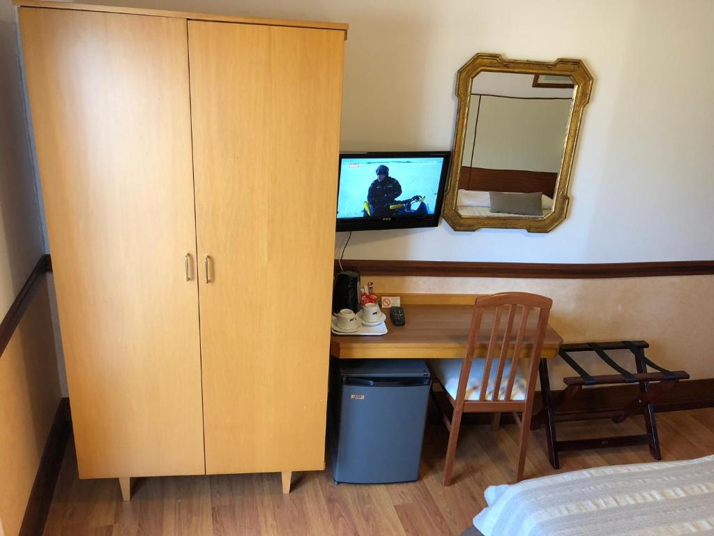 TV a/nebo společenská místnost v ubytování Hotel Signa