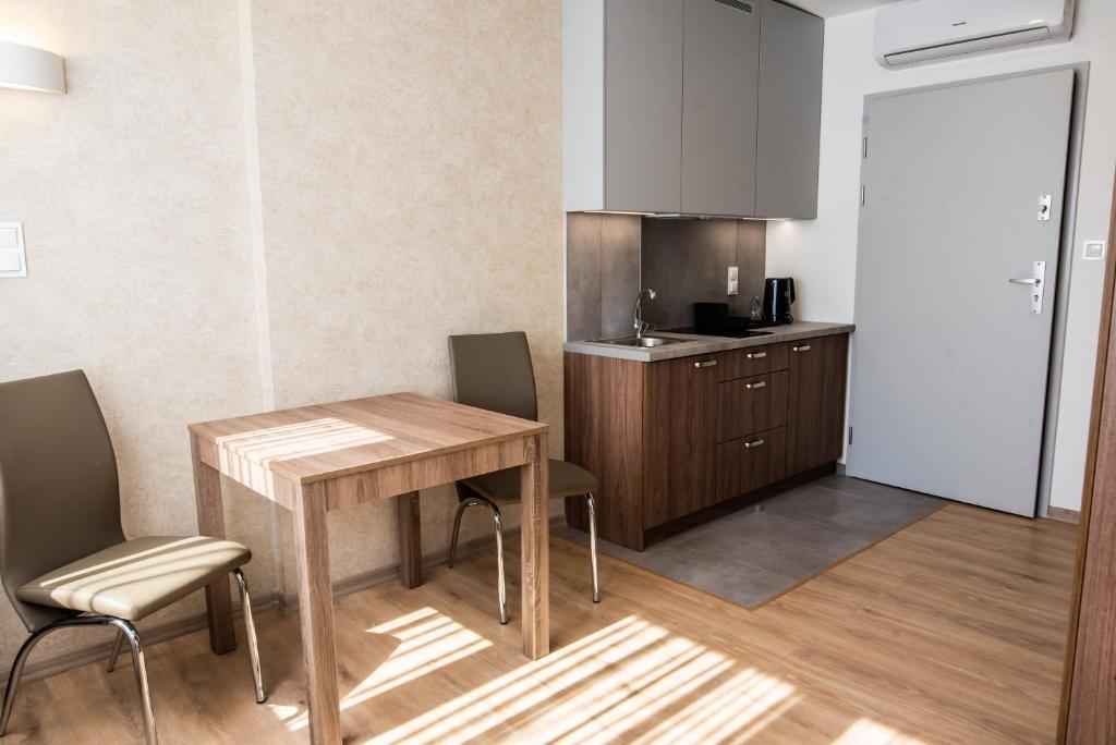 Kuchyň nebo kuchyňský kout v ubytování Apartamenty Leśne Zacisze