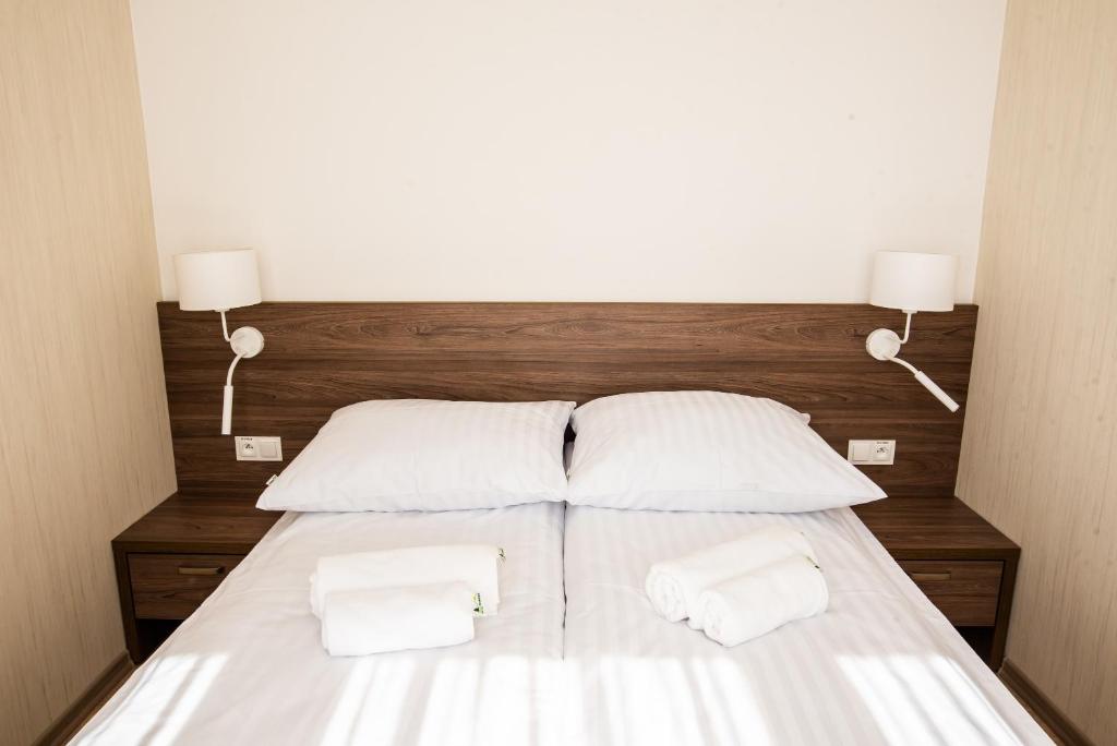 Postel nebo postele na pokoji v ubytování Apartamenty Leśne Zacisze