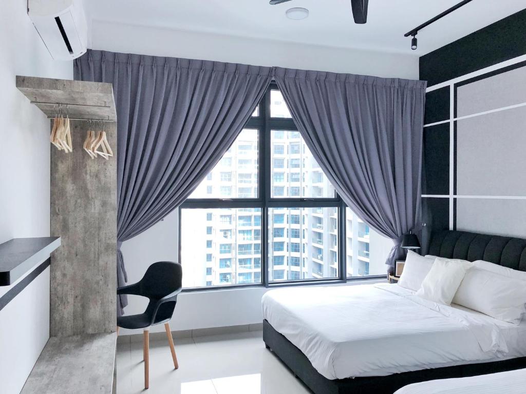 a bedroom with a bed and a large window at Atlantis Residences 1BR By 360 HOME in Malacca