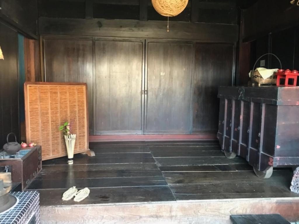 a room with wooden cabinets and a tiled floor at Wan de En - Vacation STAY 83694v in Sabae