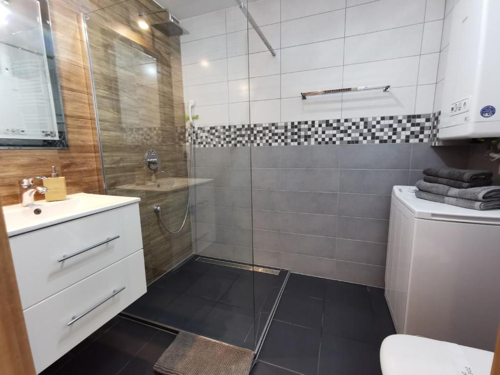 Kúpeľňa v ubytovaní Apartamenty Wybrzeże Laguna