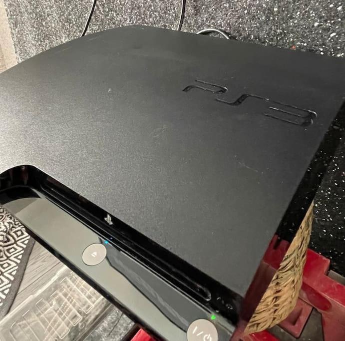 a laptop computer sitting on top of a table at Newly refurbished 3 bedroom/2bathroom entire house in Lincoln