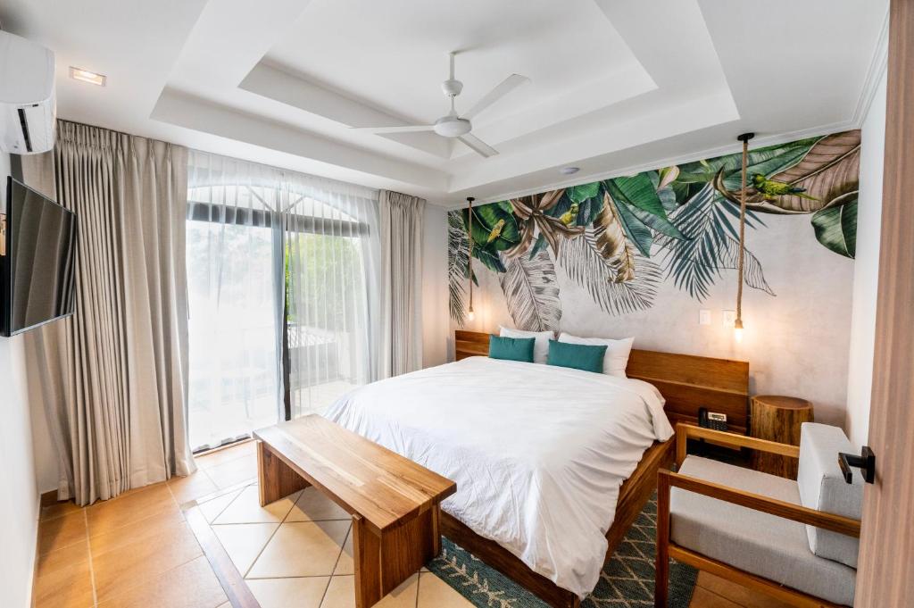 Postel nebo postele na pokoji v ubytování Marala Hotel