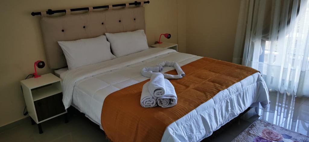 Postel nebo postele na pokoji v ubytování Apart hotel Florida