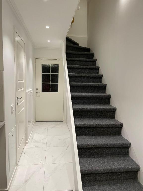 a staircase in a house with a stair case at The Studio in Stockholm