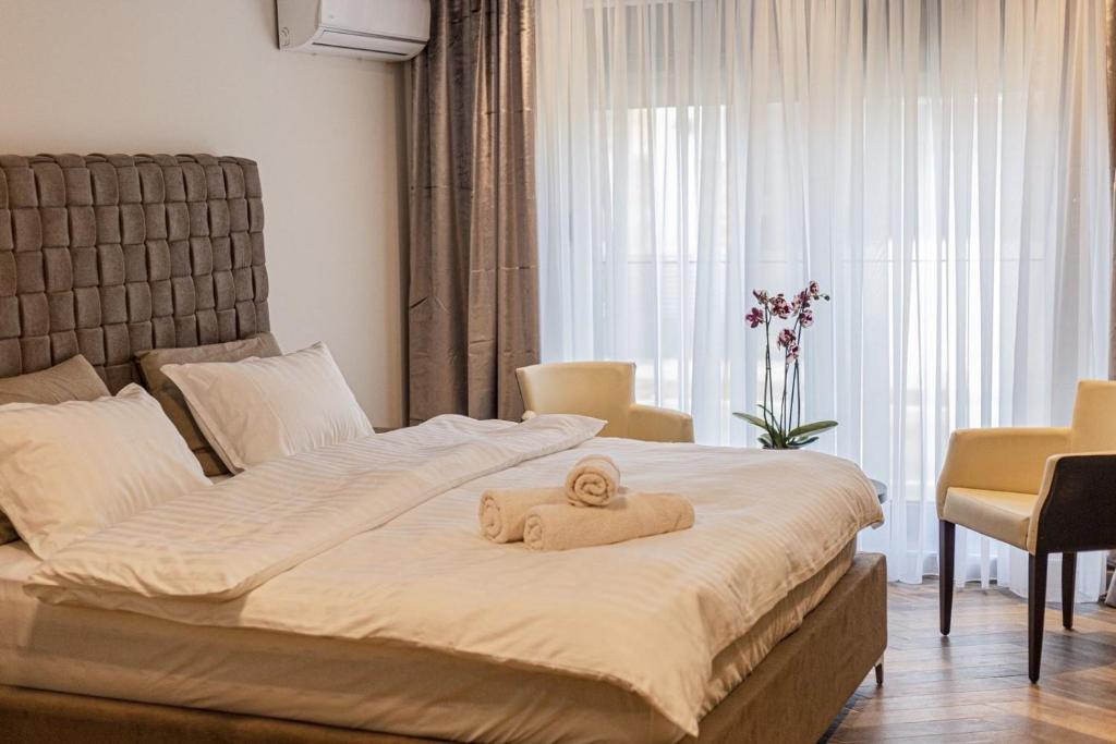 Postel nebo postele na pokoji v ubytování Perla Lux apartmani