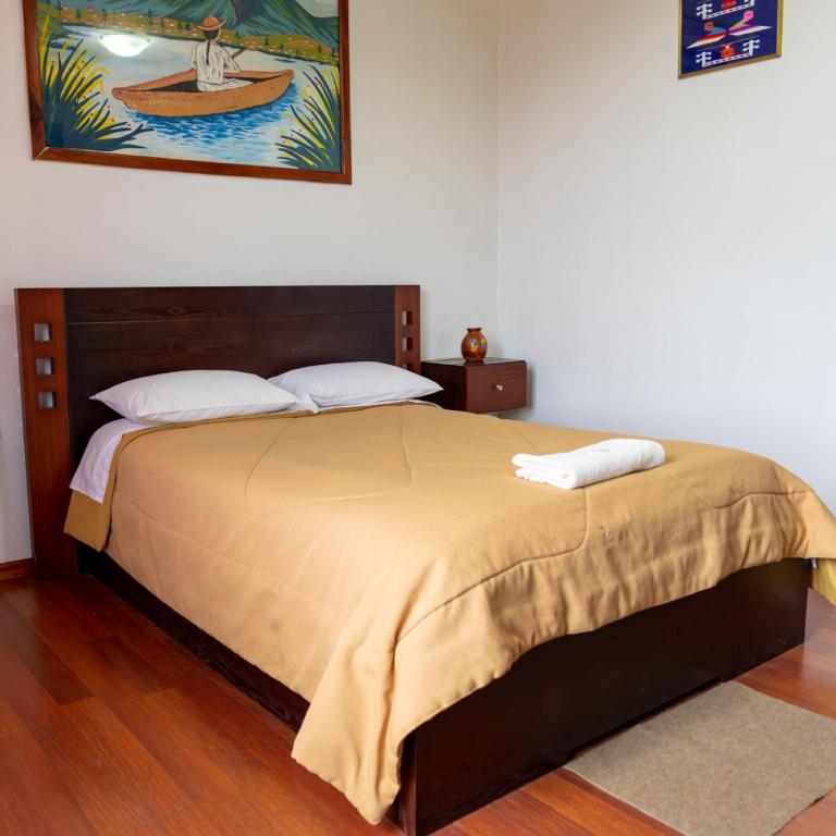 Postel nebo postele na pokoji v ubytování Mashy´s Hostal