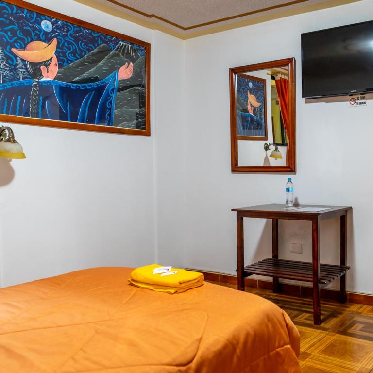 Postel nebo postele na pokoji v ubytování Mashy´s Hostal
