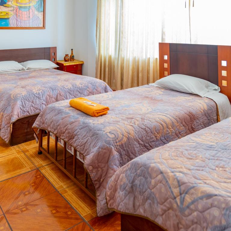 Postel nebo postele na pokoji v ubytování Mashy´s Hostal