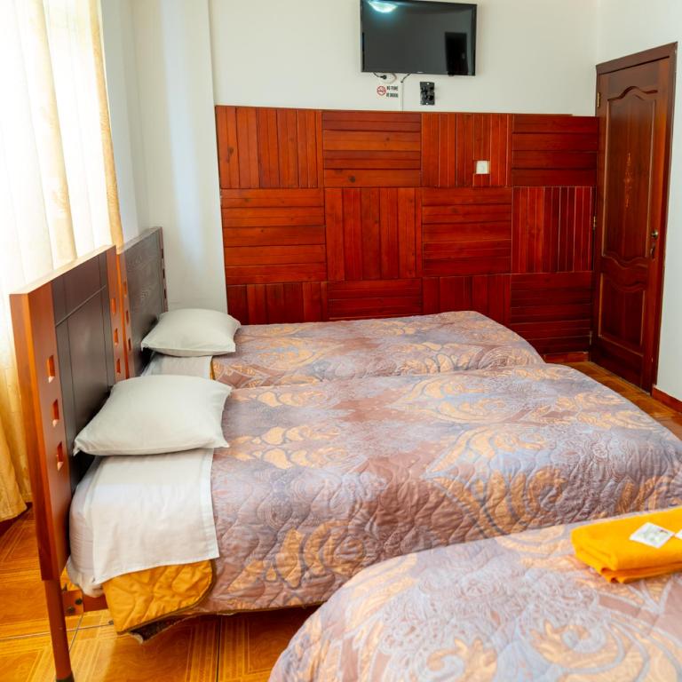 Postel nebo postele na pokoji v ubytování Mashy´s Hostal