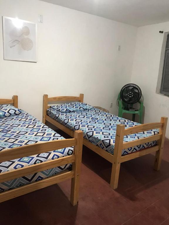 Postel nebo postele na pokoji v ubytování Pousada Cisne Branco