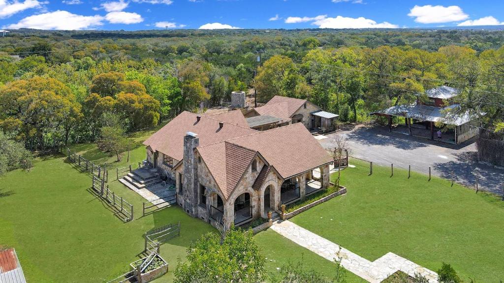 an aerial view of a large estate with a house at Milk Bath Springs House in Dripping Springs