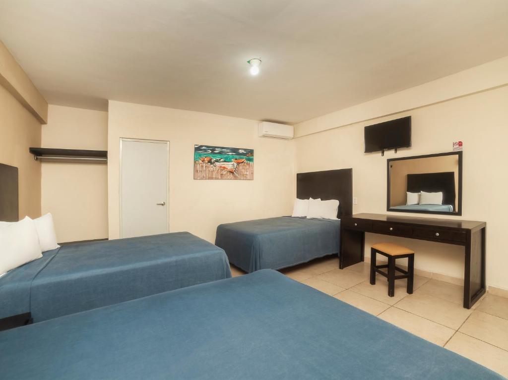 TV a/nebo společenská místnost v ubytování Hotel Puerto Inn