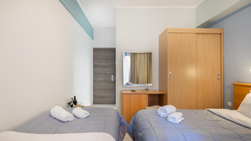 Ένα ή περισσότερα κρεβάτια σε δωμάτιο στο Diros Hotel