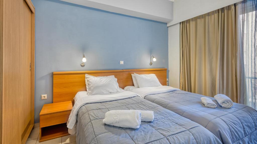 Ένα ή περισσότερα κρεβάτια σε δωμάτιο στο Diros Hotel